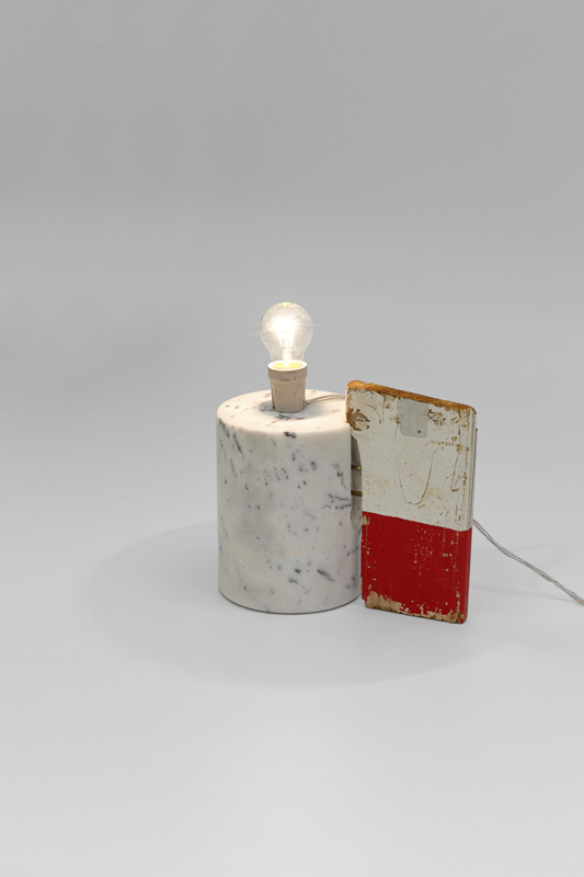 Marble, wood, electrical wire and light bulb