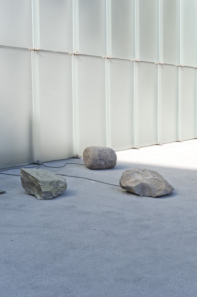 Quarried stones, amplifier, cable, exciters 6-channel, 1-hour audio sound composition (looped)